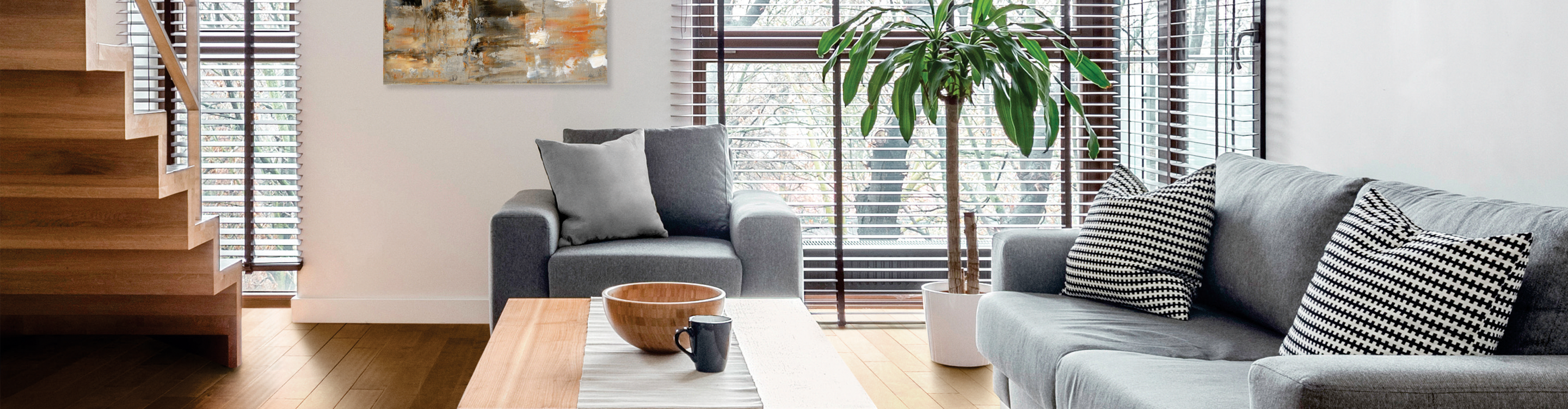 wood look brown blinds in living area with grey furniture and light hardwood floors